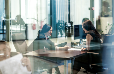  two women at desk