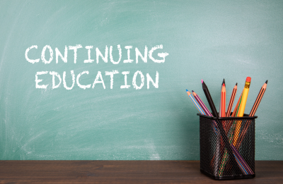 chalkboard with continuing education written in chalk and pens