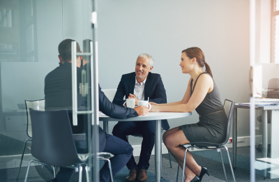 three people in a meeting