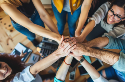 workers with hands together