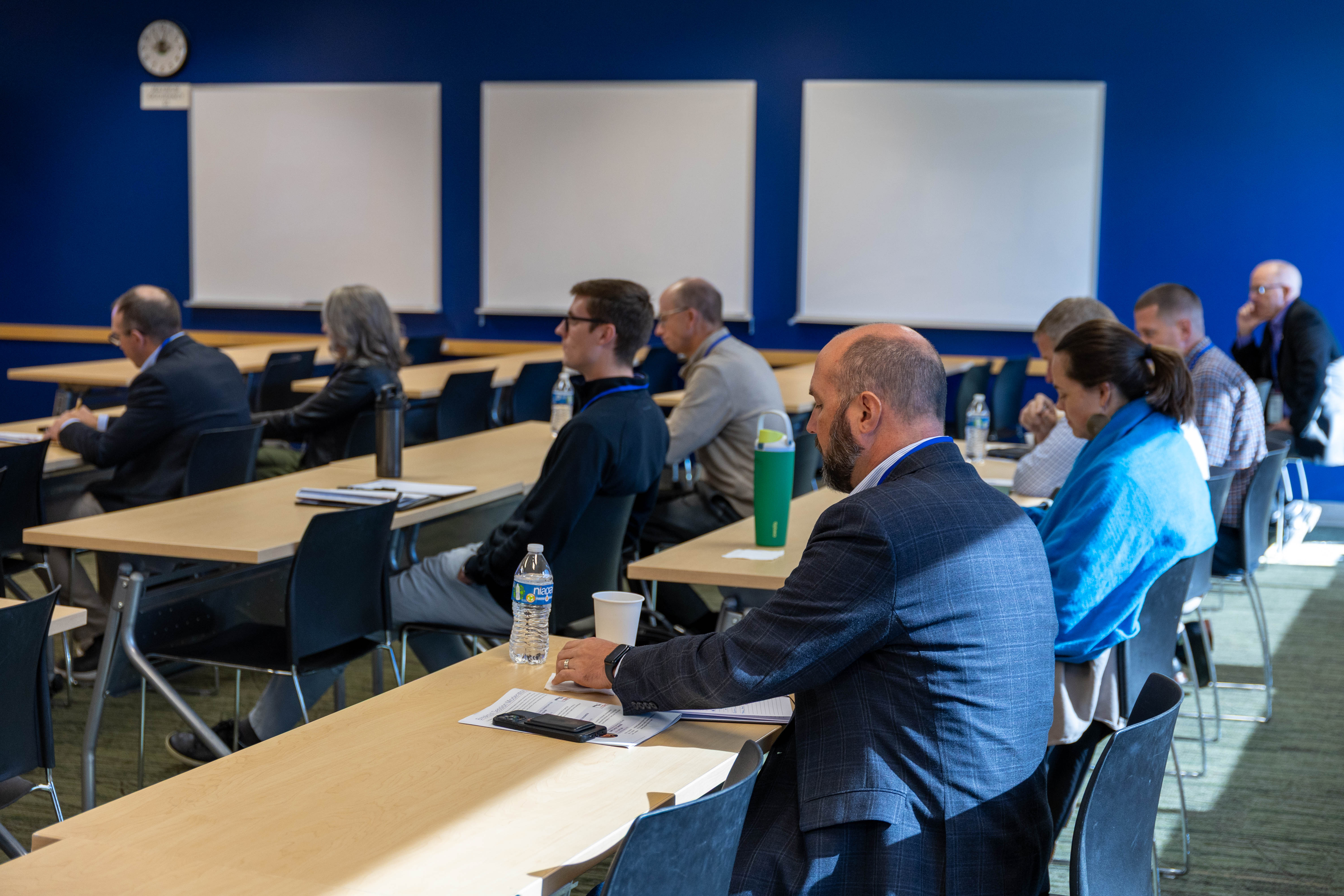 businessmen and women in a classroom