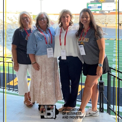 4 people at Kinnick Stadium
