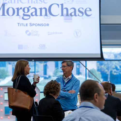 people in a conversation at the conference