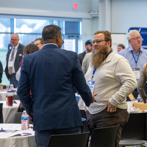 men in conversation at conference