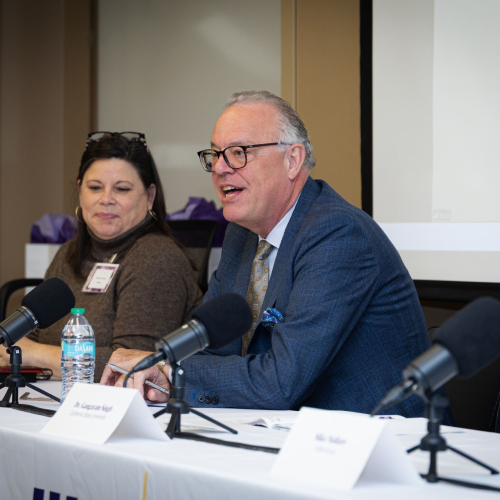 woman and man at conference table